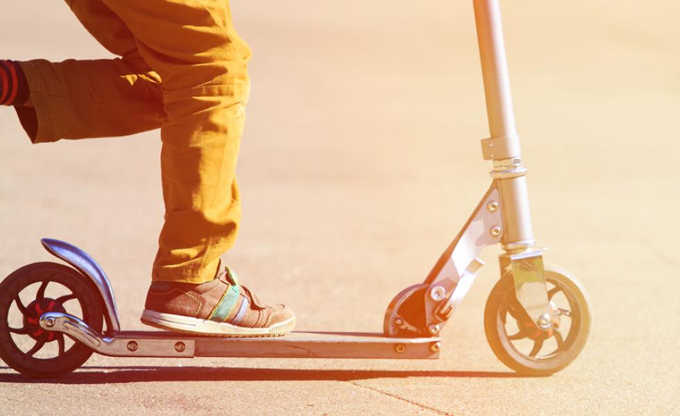 Child riding a scooter.