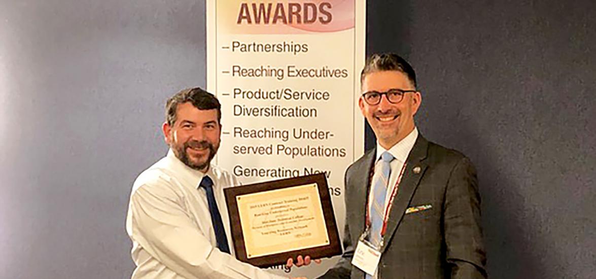 Eric Johnson, right, presents the LERN Training Award for Excellence in Reaching Underserved Populations to Mid-State Technical College Workforce Development Manager Craig Bernstein at the LERN Contract Training Conference on March 20 in Chicago.