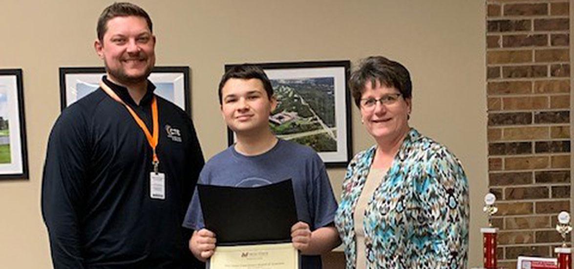 Mid-State Technical College Foundation Director Jill Steckbauer, right, presents SPASH student Brett Shuda with a $500 scholarship on March 6. Also pictured, left, is Ryan Kawski, career and technical education coordinator at SPASH.