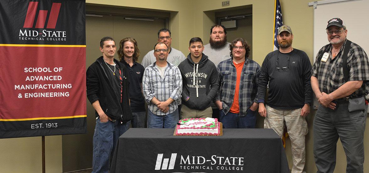 Mid-State Pre-Apprenticeship Machine Tool Training students during their graduation from the program on the Wisconsin Rapids campus, May 23, 2019. From left: Dan Wetzel, Jordan Donahue, Robin Quinnell, Hector Corral, Nick Hibbard, Ethan Thomas, Jarrod Thomas, Lynn Roberts and Tom Watson.