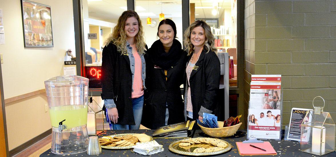 Visitors to Mid-State Technical College’s Joico product launch on the Wisconsin Rapids Campus on Oct. 23 were greeted by part-time Cosmetology and Barber Technologist instructors, from left, Josie Stoflet, Riley Damrow and Christy Hoffman.