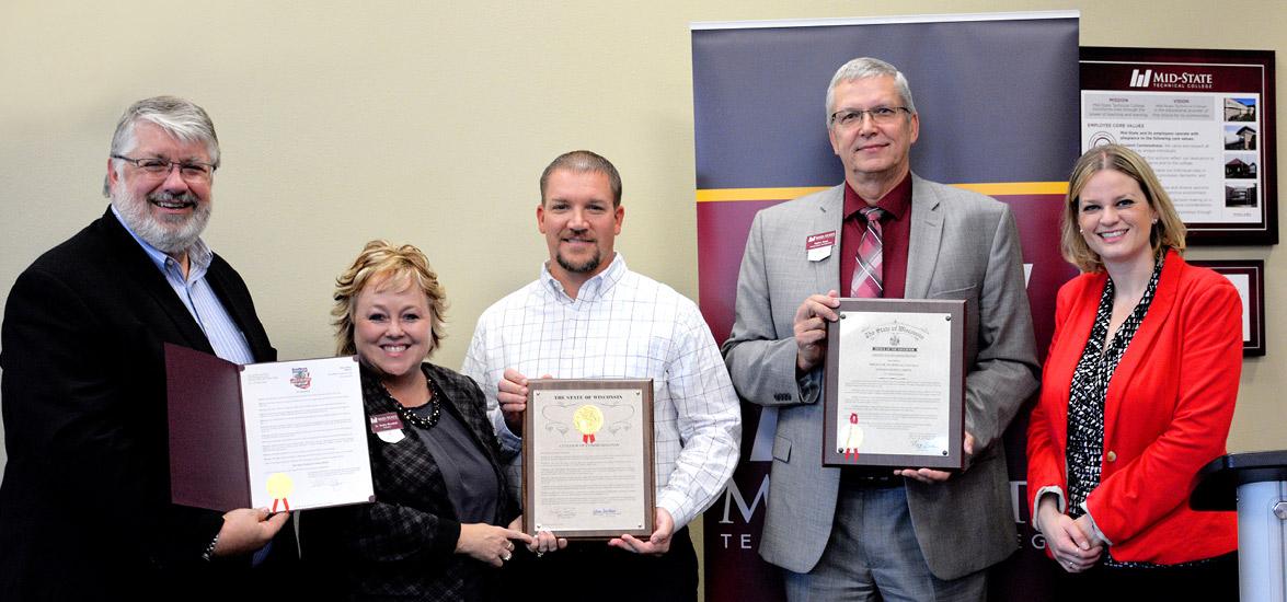 Displaying the Mid-State Month Mayor’s Proclamation, Citation of Commendation and Governor’s Certificate of Commendation, from left: Stevens Point Mayor Mike Wiza, Mid-State President Dr. Shelly Mondeik, Mid-State Board Member Justin Hoerter, Mid-State Dean of Stevens Point Campus Volker Gaul and State Representative Katrina Shankland.