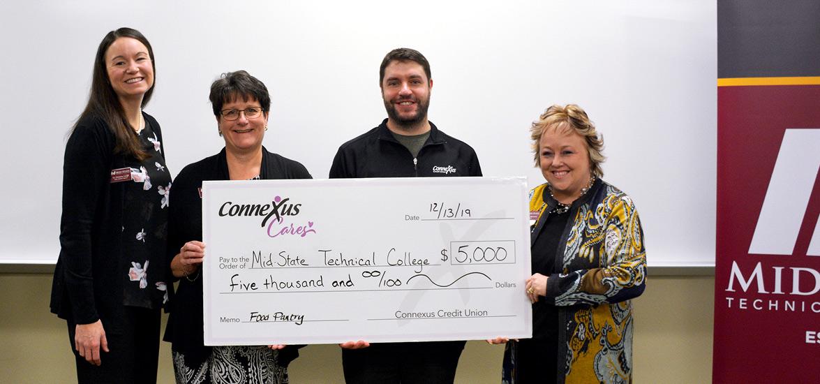 Mid-State Dean of Student Services Christina Lorge, Mid-State Foundation Director Jill Steckbauer, Connexus Member Experience Manager Craig Stancher and Mid-State President Dr. Shelly Mondeik during a Dec. 13 event on the Stevens Point Campus celebrating the company’s $5,000 donation to the Mid-State Foundation. 