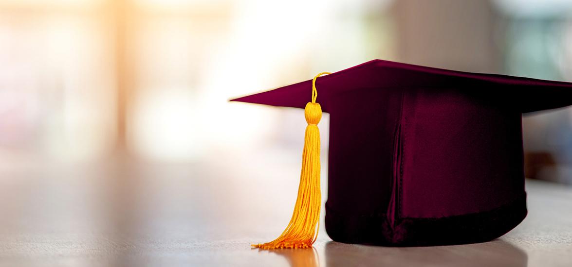 Maroon graduation cap with gold tassel