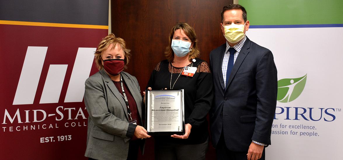 From left, Mid-State Technical College President Shelly Mondeik presents the 2020 Futuremaker Partner Award to Aspirus Riverview Hospital and Clinics representatives Kim Johnson, vice president of patient care and nursing officer, and Chris Stines, president.