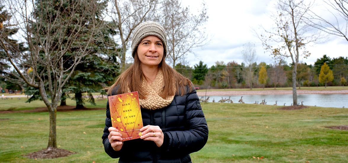 Mid-State Communication Instructor Jill Sisson Quinn with her recently published nonfiction essay collection “Sign Here If You Exist.”