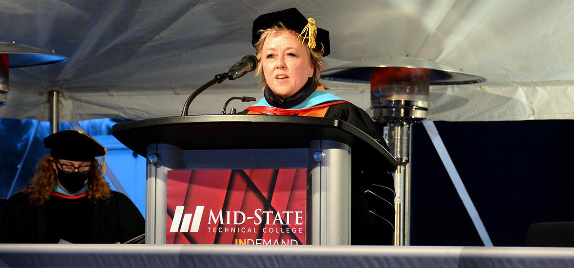 Mid-State Technical College President Dr. Shelly Mondeik addresses graduates attending the College’s outdoor graduation ceremonies on the Wisconsin Rapids Campus, Dec. 13.