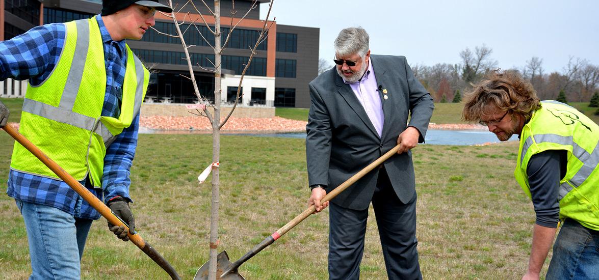 Mid-State Technical College Arborist Technician students help Stevens Point Mayor Mike Wiza, center, plant the City’s Arbor Day ceremonial tree adjacent to Skyward on EM Copps Drive, Stevens Point, April 27. The tree was one of 31 new trees to be planted by the students this week on the property.