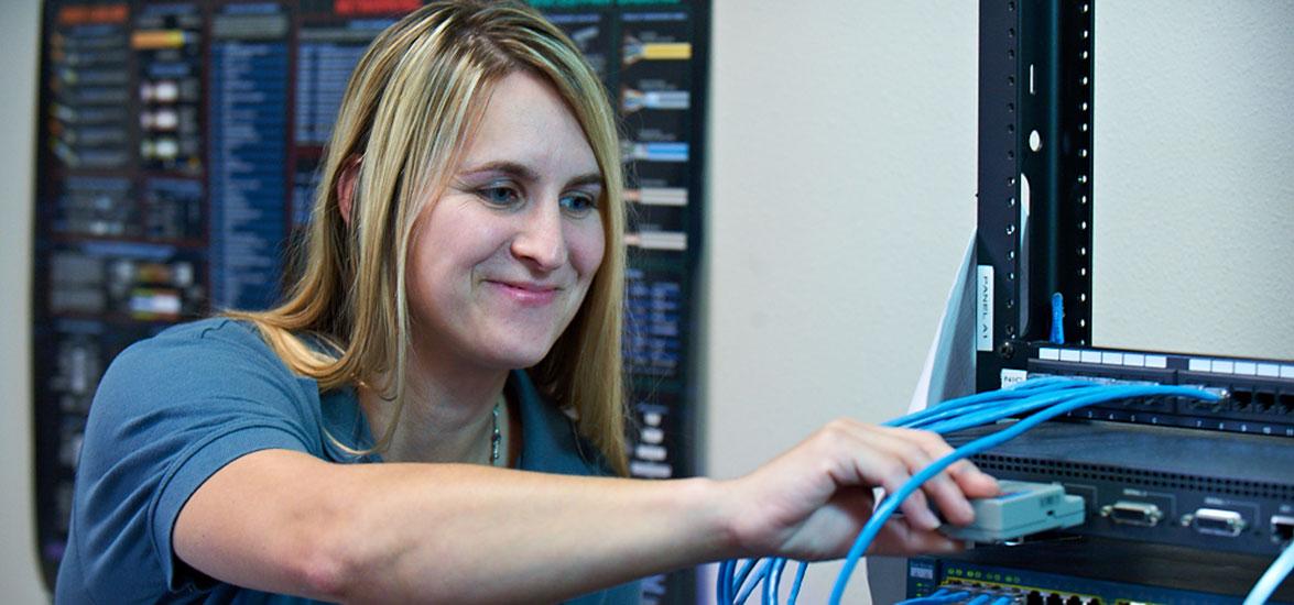 A Mid-State Technical College IT Network Specialist student gets hands-on practice connecting a router to the network. The associate degree program along with IT Software Development are two additional Mid-State degrees that transfer into UW–Stevens Point’s bachelor of science degrees under new quality transfer agreement between the two institutions.