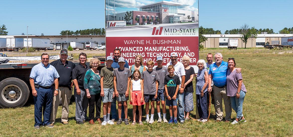 Gathered at the site of the future Wayne H. Bushman Advanced Manufacturing, Engineering Technology and Apprenticeship Center in Stevens Point, from left, are County Board of Supervisors Chair Al Haga, Wayne Bushman and the Bushman family. The college’s site dedication took place on Friday, July 22. (Photo by Jessica Kopecky Design)