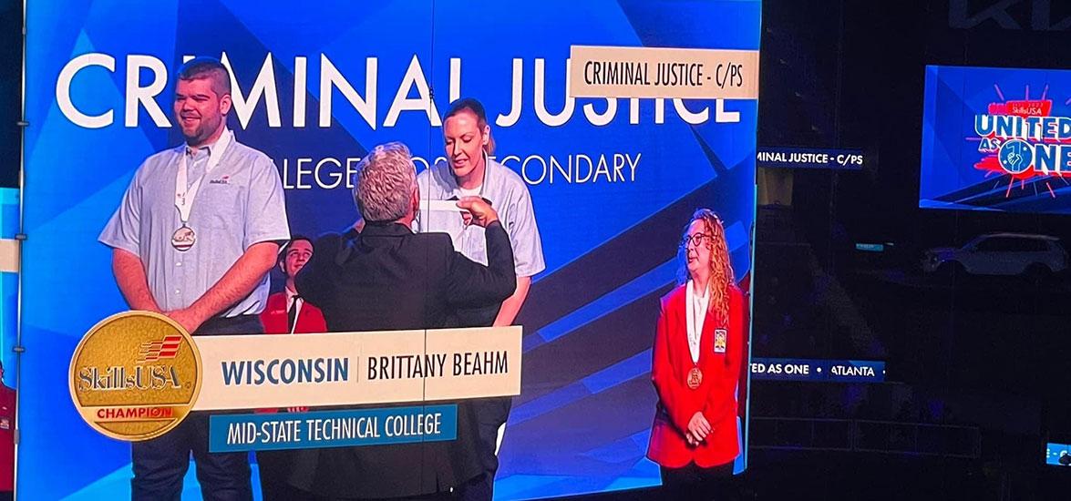 Mid-State student Brittany Beahm on the jumbotron screen receiving her gold medal for the Criminal Justice competition at the 2022 SkillsUSA National Leadership & Skills Conference in Atlanta this June. Beahm was one of four students from Mid-State who placed in the top ten in their competitive events.