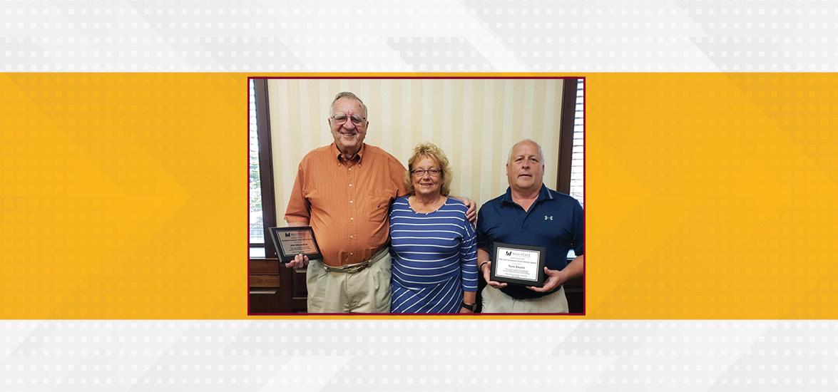 Mid-State Foundation Board of Directors President Mary Jo Green presents retiring board members Jim Shewchuk, left, and Tom Ekelin with plaques recognizing their long record of service on July 13 in Wisconsin Rapids.