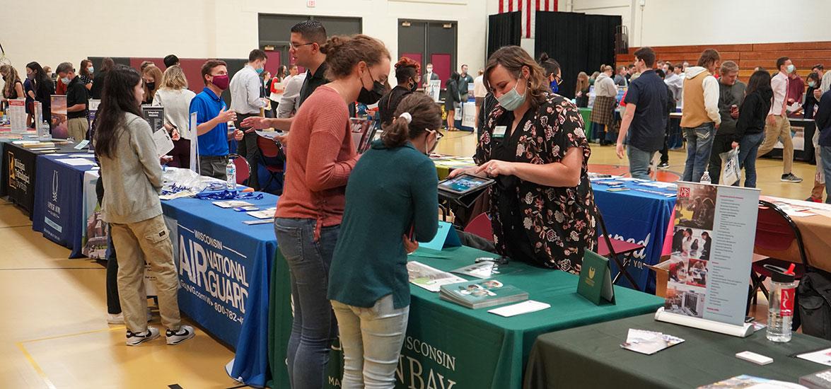 Attendees at the 2021 Wisconsin Education Fair chat with college representatives on the Wisconsin Rapids Campus of Mid-State Technical College. This year’s fair will be held Tuesday, Sept. 27.