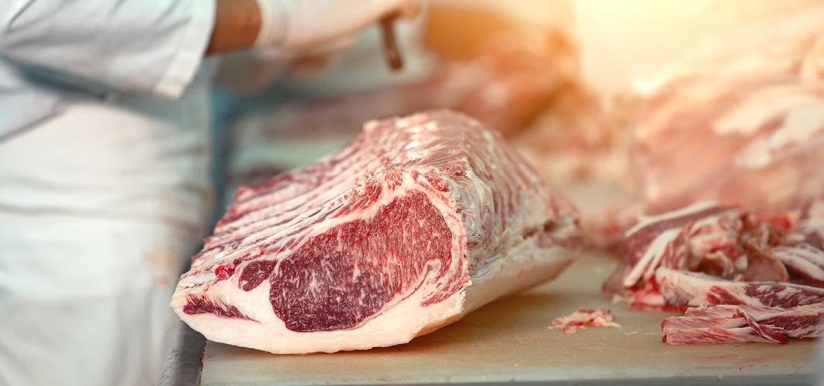 Large slab of meat on a counter with fat trimmings on the side. A butcher is depicted in the background.