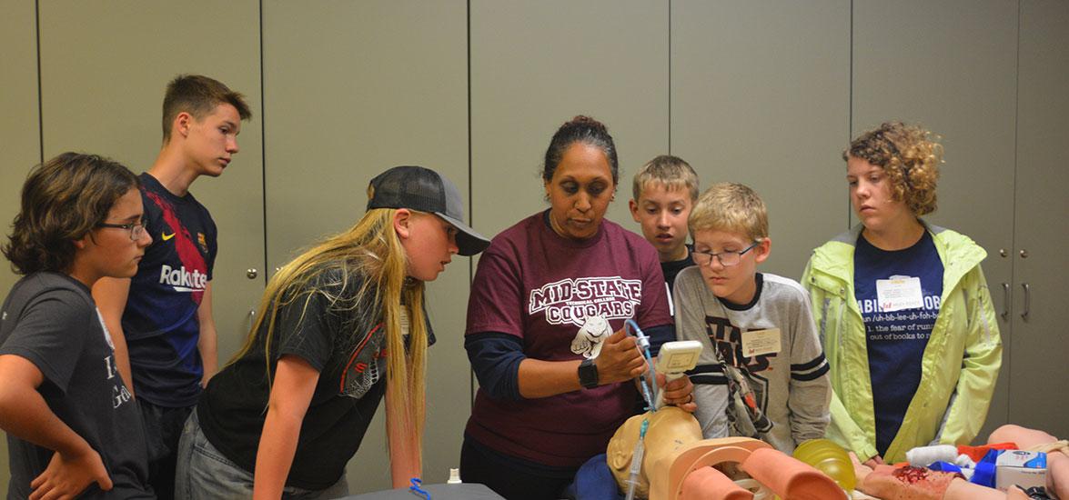 College Camp participants explore the Emergency Medical Technician program on the Wisconsin Rapids campus during last year’s event in June.