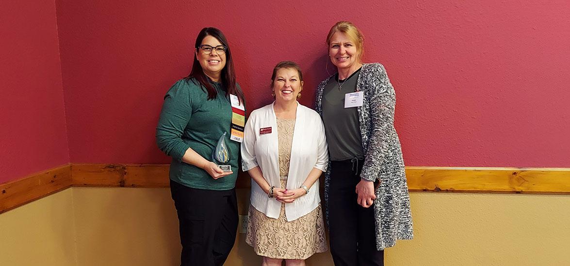 Julie Larsen accepts the Spirit of Wisconsin Health Information Management Association (WHIMA) Award, May 17. From left: Julie Larsen, Mid-State instructor and program director, Health Information Management; Dr. Colleen Kane, dean of the School of Health and the School of Protective & Human Services; Angela Voight, instructor, Health Information Management.