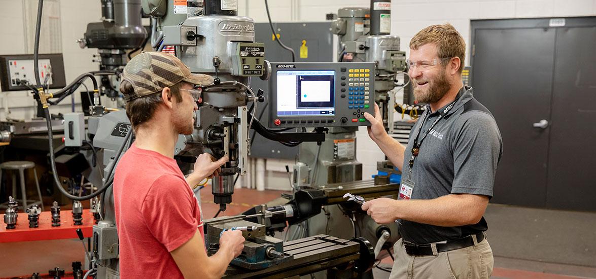 Mid-State Technical College student and instructor work in the Precision Machining Technician lab.