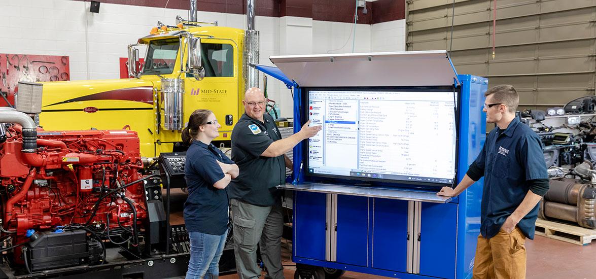 Mid-State Technical College Diesel & Heavy Equipment Technician program instructor and students.