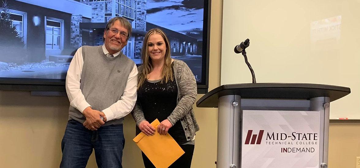 From left: Oneida poet Louis V. Clarke at the 2023 Wisconsin Writers Connect event with Maria Boggs, Mid-State University Transfer-Associate of Science student and a 2023 Write on the Money contest winner.