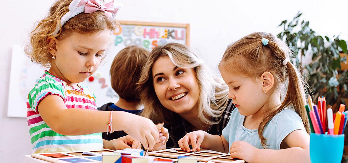 Early childhood professional working with young children.