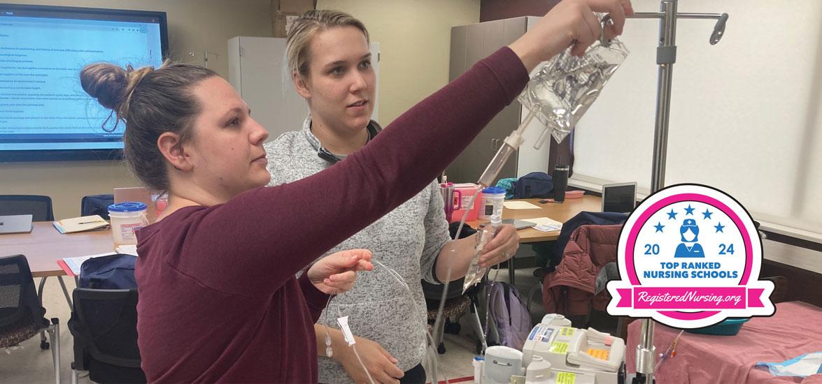 Two Mid-State Nursing students with RegisteredNursing.org badge for the 2024 Top Ranked Nursing Schools.