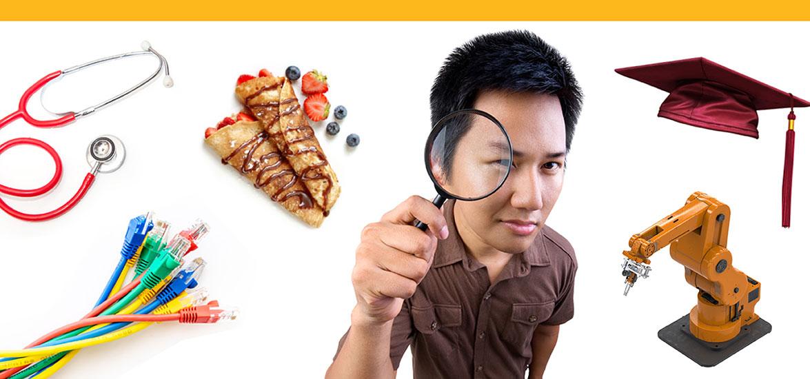 Person looking through a magnifying glass with a stethoscope, cables, pastry, graduation cap, and robotic arm surrounding them.