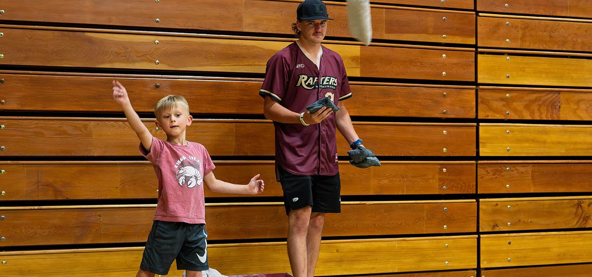 A “Rafters Meet-and-Greet” attendee competes in the Cornhole challenge against a Rafters player at the 2024 event held on Mid-State’s Wisconsin Rapids Campus. This year’s event will be held on June 11.