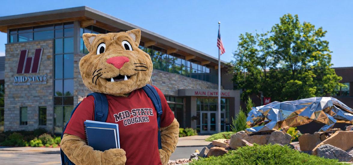 Mid-State’s mascot, Grit, stands in front of the main entrance of the College’s Wisconsin Rapids Campus.