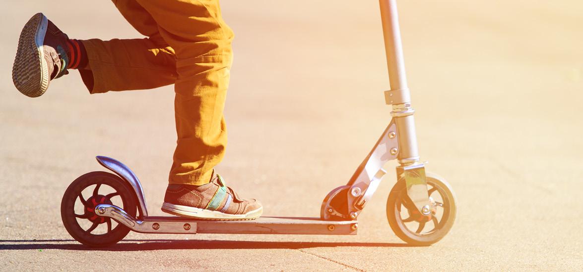 Child riding a scooter.