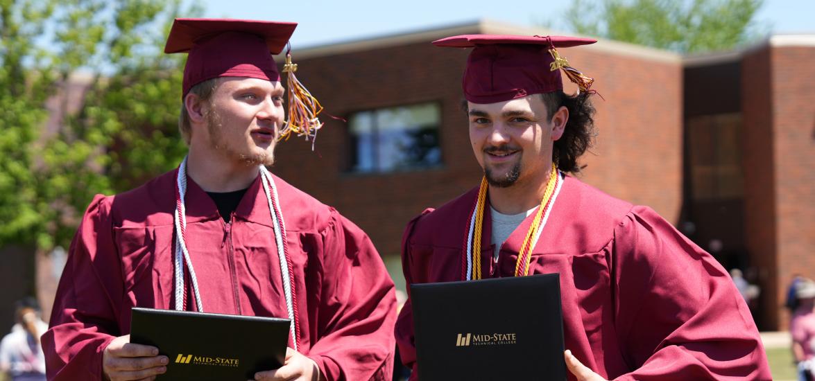 Two Mid-State Technical College graduates just after receiving their diplomas at the spring commencement on the Wisconsin Rapids Campus, May 16, 2026.