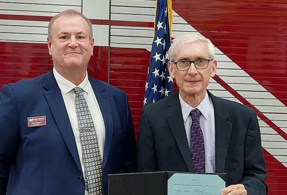 Mid-State Technical College Associate Dean of Protective & Human Services Rick Anderson, left, with Gov. Tony Evers just after the signing of Assembly Bill 297 on Dec. 6 at the Amherst Fire District. station. 