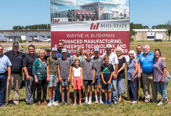 Gathered at the site of the future Wayne H. Bushman Advanced Manufacturing, Engineering Technology and Apprenticeship Center in Stevens Point, from left, are County Board of Supervisors Chair Al Haga, Wayne Bushman and the Bushman family. The college’s site dedication took place on Friday, July 22. (Photo by Jessica Kopecky Design)