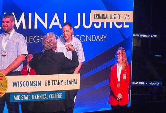 Mid-State student Brittany Beahm on the jumbotron screen receiving her gold medal for the Criminal Justice competition at the 2022 SkillsUSA National Leadership & Skills Conference in Atlanta this June. Beahm was one of four students from Mid-State who placed in the top ten in their competitive events.
