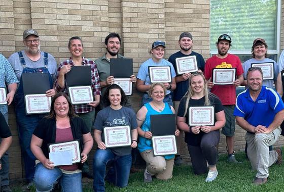The twelve Meat Cutting and Butchery certificate completers with Adam Schlafke, Mid-State instructor and Master Meat Crafter; Mark Cournoyer, Auburndale High School agriculture science teacher; Betsy Leonard, Wisconsin Technical College System education director of agriculture, natural resources & STEM; and Randy Romanski, secretary of the Wisconsin Department of Agriculture, Trade and Consumer Protection (DATCP).