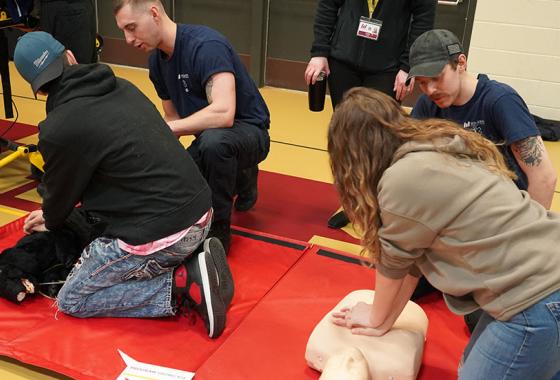 Program Showcase students learn how to provide CPR using a dog and a human manikin in a hands-on career exploration activity for Mid-State’s Emergency Medical Technician and Paramedic Technician programs during the spring 2023 event on the College’s Wisconsin Rapids Campus.