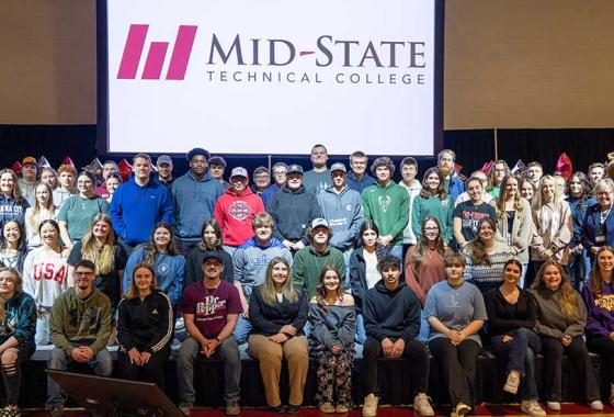 Admit Day attendees who have committed to attending Mid-State upon graduating from high school, on May 2 on the Wisconsin Rapids Campus. Also pictured; Mid-State’s mascot, Grit, and Mid-State’s president, Dr. Shelly Mondeik, center.