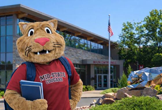 Mid-State’s mascot, Grit, stands in front of the main entrance of the College’s Wisconsin Rapids Campus.
