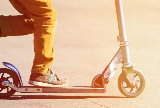 Child riding a scooter.