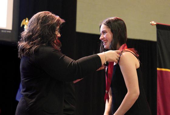 Mid-State Technical College Nursing program graduate Katie Hames receives her nursing pin from Mid-State Nursing Instructor Kristi Busscher during the College’s pinning ceremony on the Wisconsin Rapids Campus, May 19.